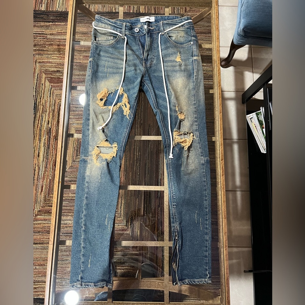 Fashion, nova men’s jeans, size 32, blue with tan tearing.